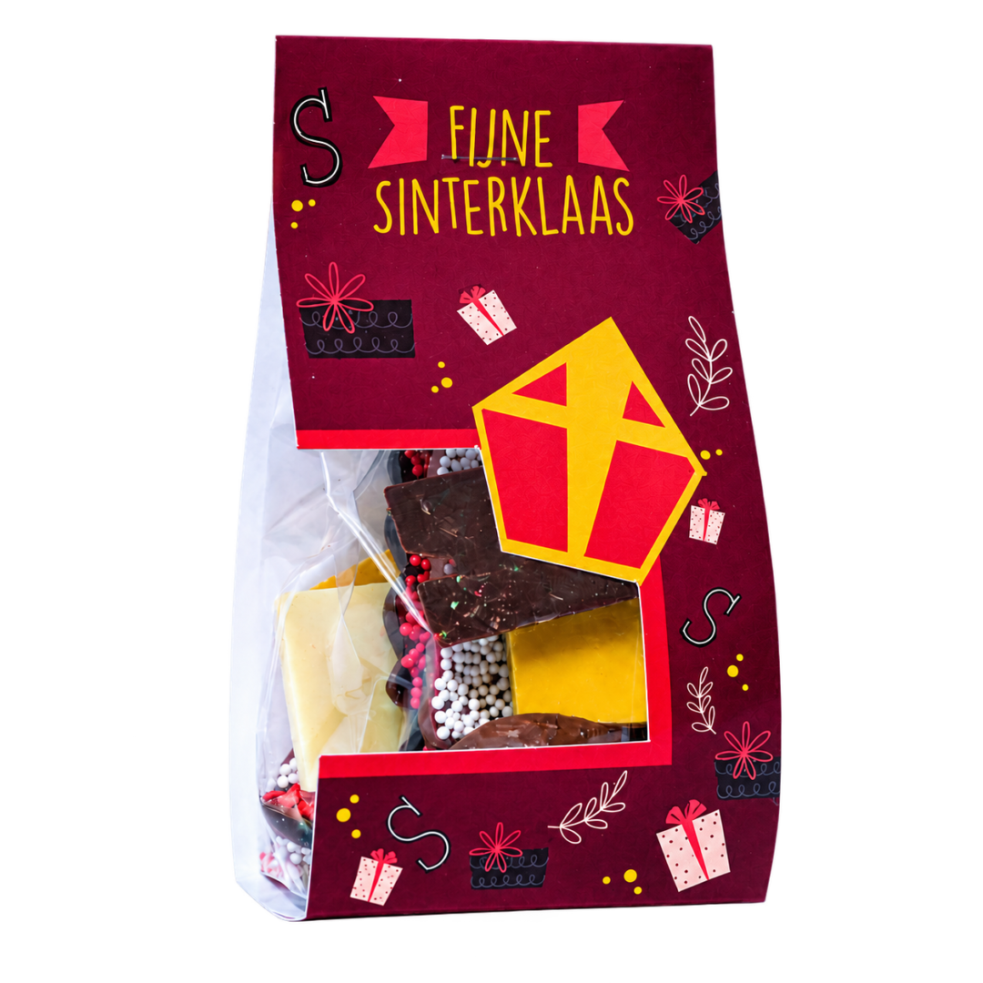 Blokzakje met kopkaartje gevuld met circa 100 gram assorti chocolade, waaronder Sinterklaasjes, Sinterklaasjes met musket, Pietjes, kleine chocoladeletters en choco tabletjes. Tasty Present - gepersonaliseerde chocolade en snoep