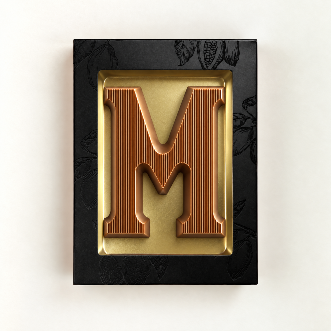 Melk Chocoladeletter M met bronzen finish. Leuk als relatiegeschenk